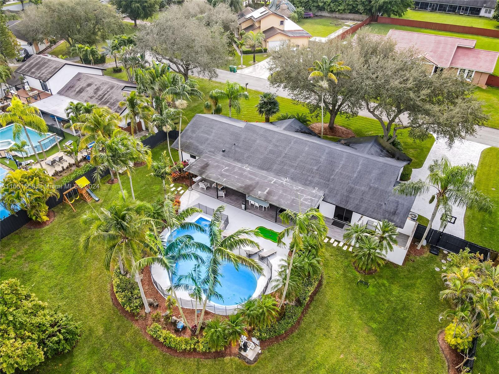 a view of a swimming pool with a yard