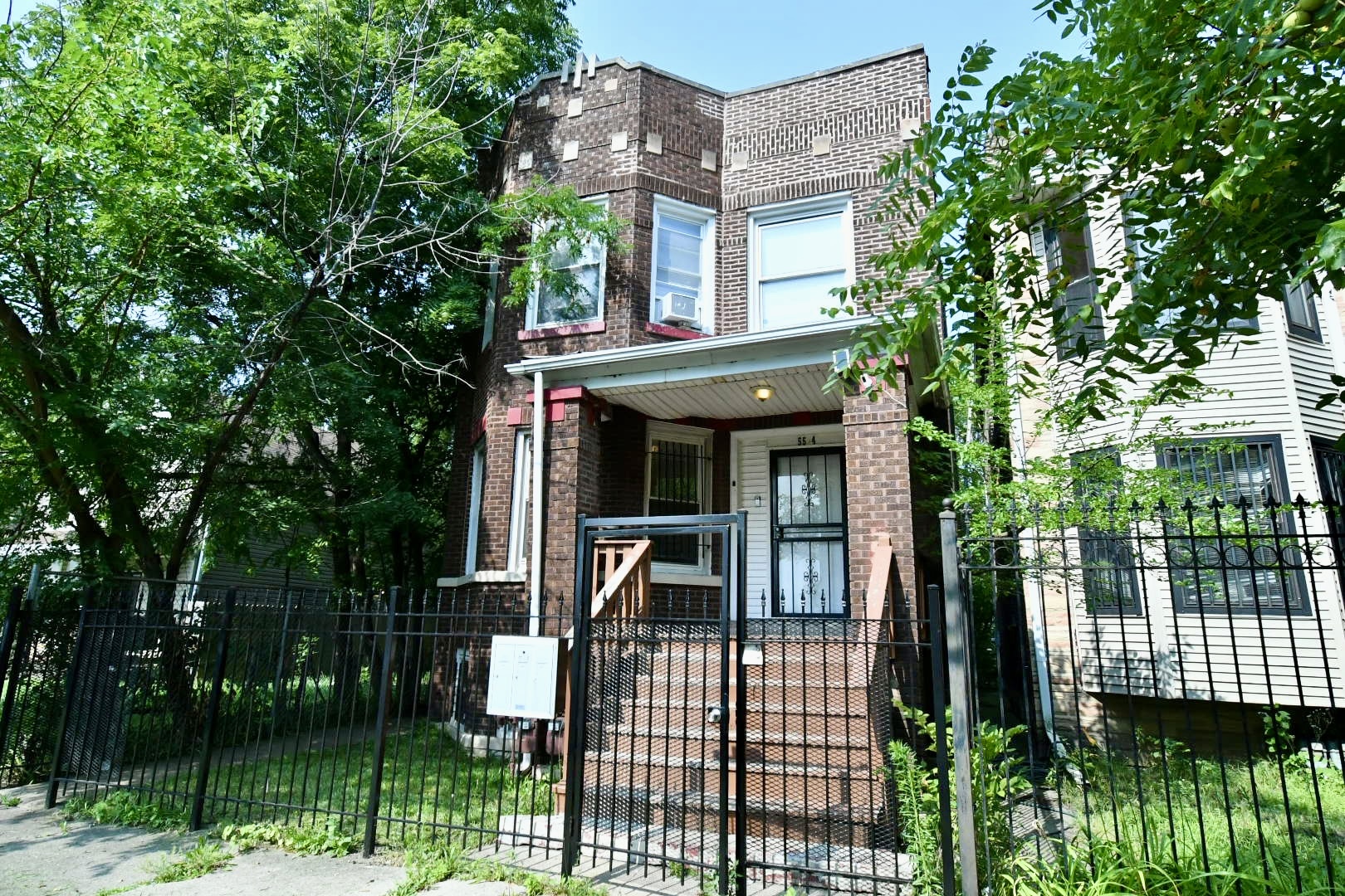 front view of a house with a garden