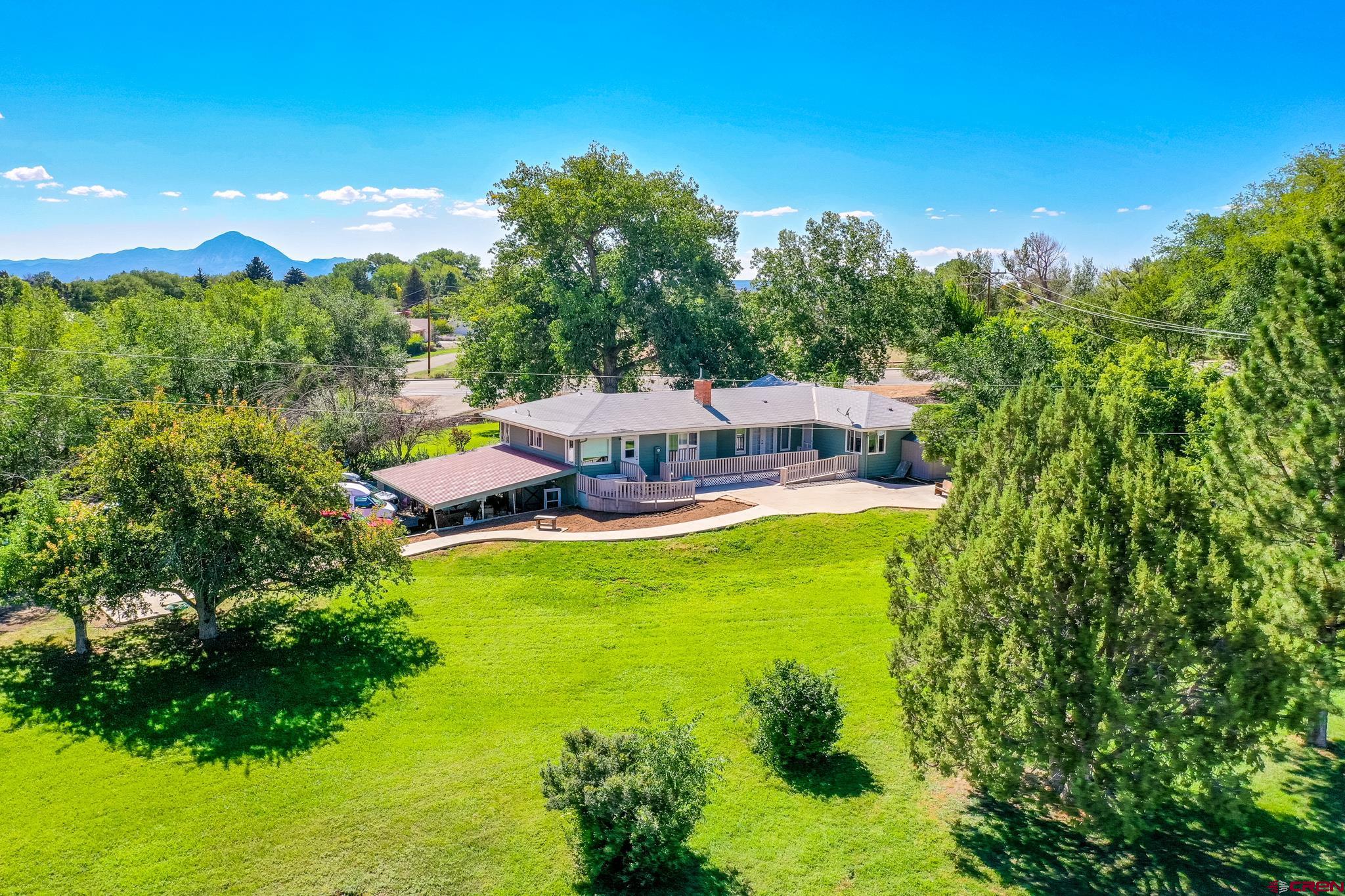 a view of a house with a big yard