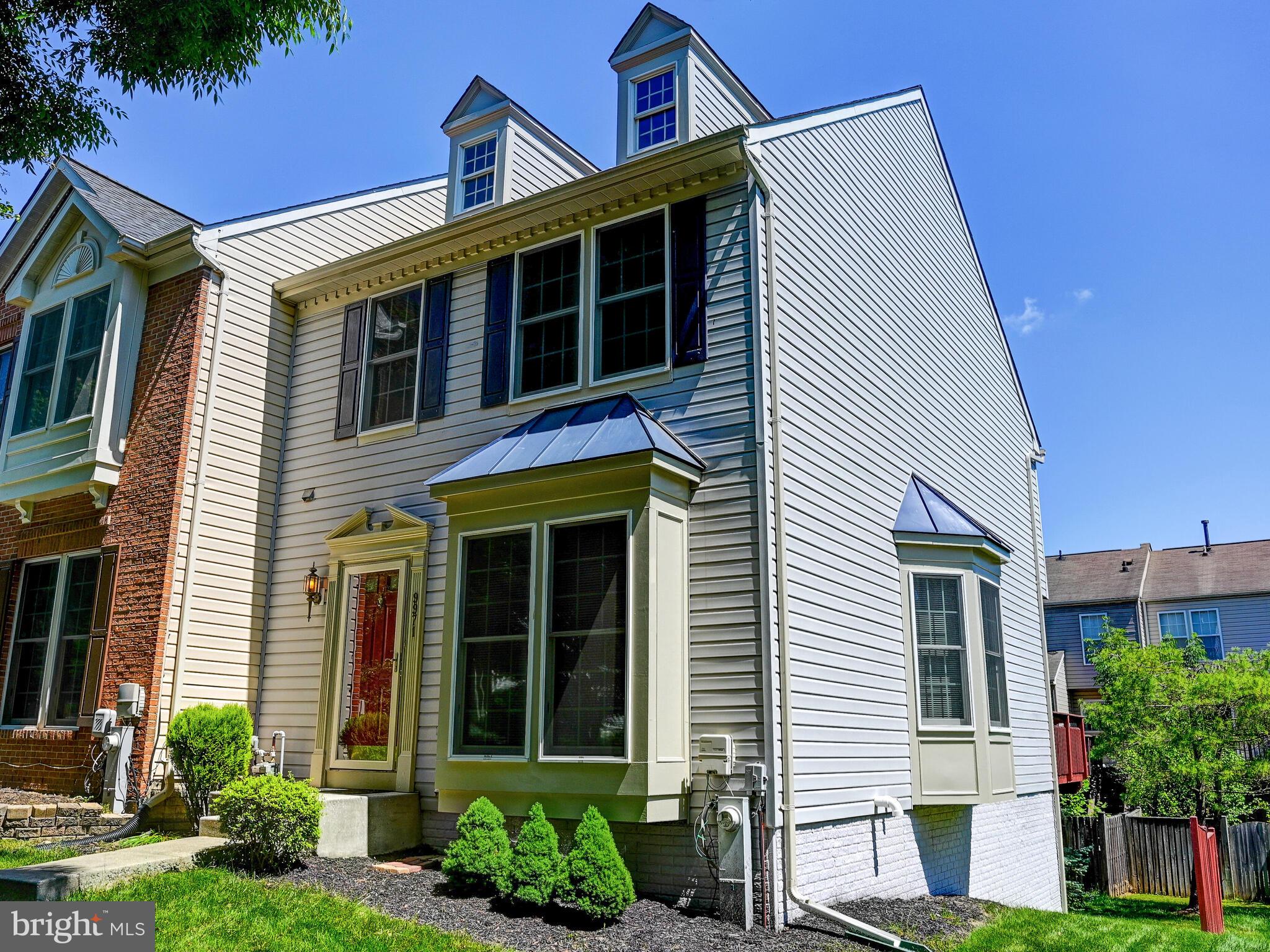 a view of a house with a yard and plants