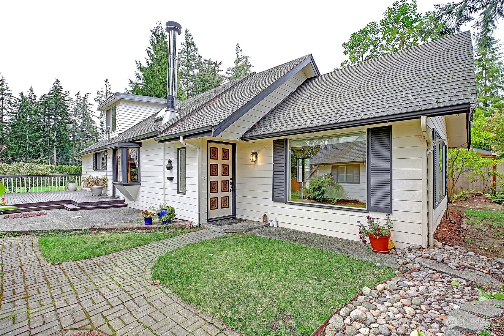 a front view of a house with garden