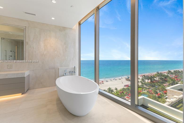 a bathroom with a bathtub and shower