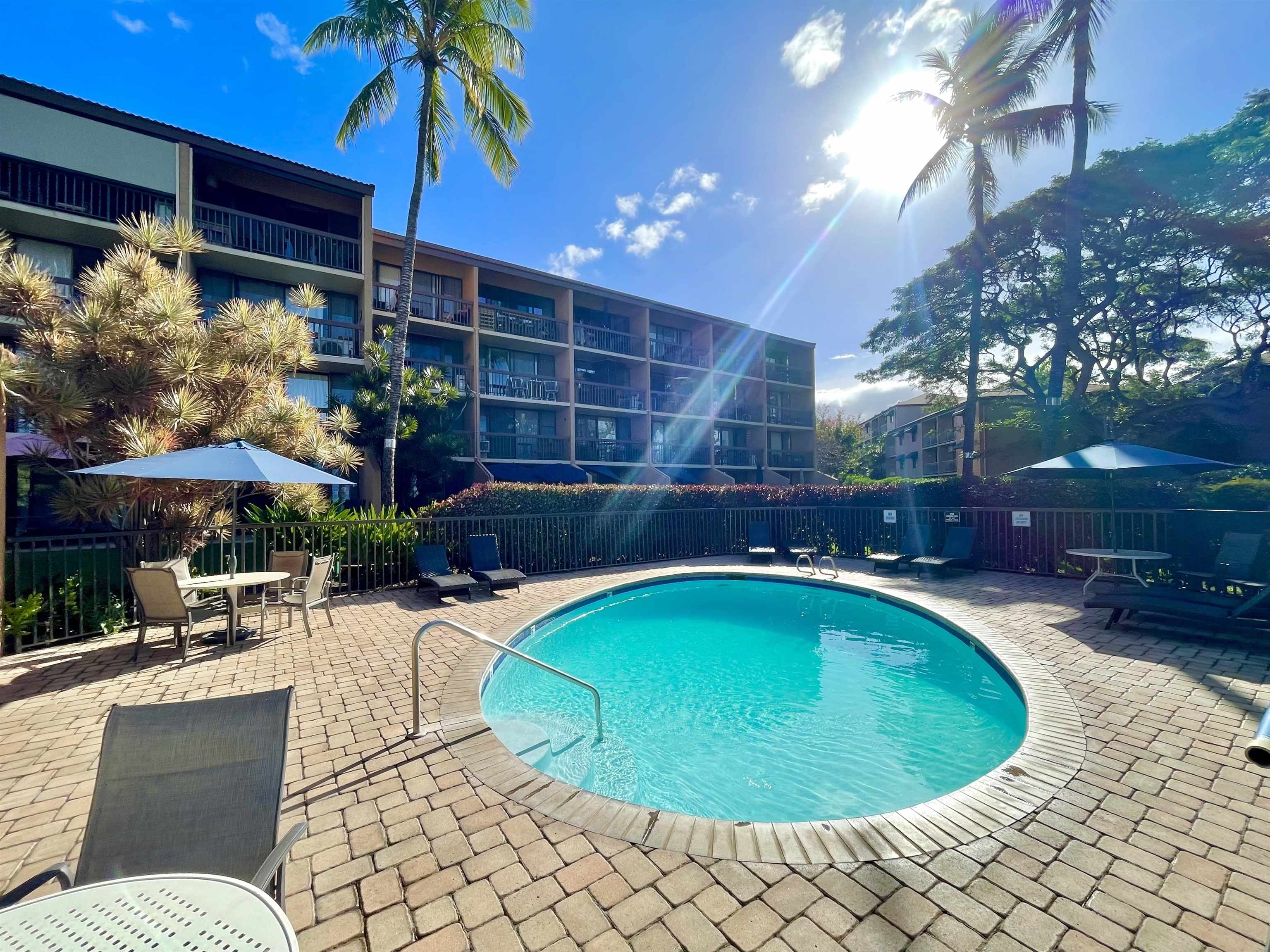 a view of a swimming pool with a patio