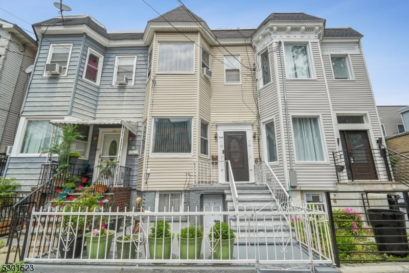 a front view of a house with a porch