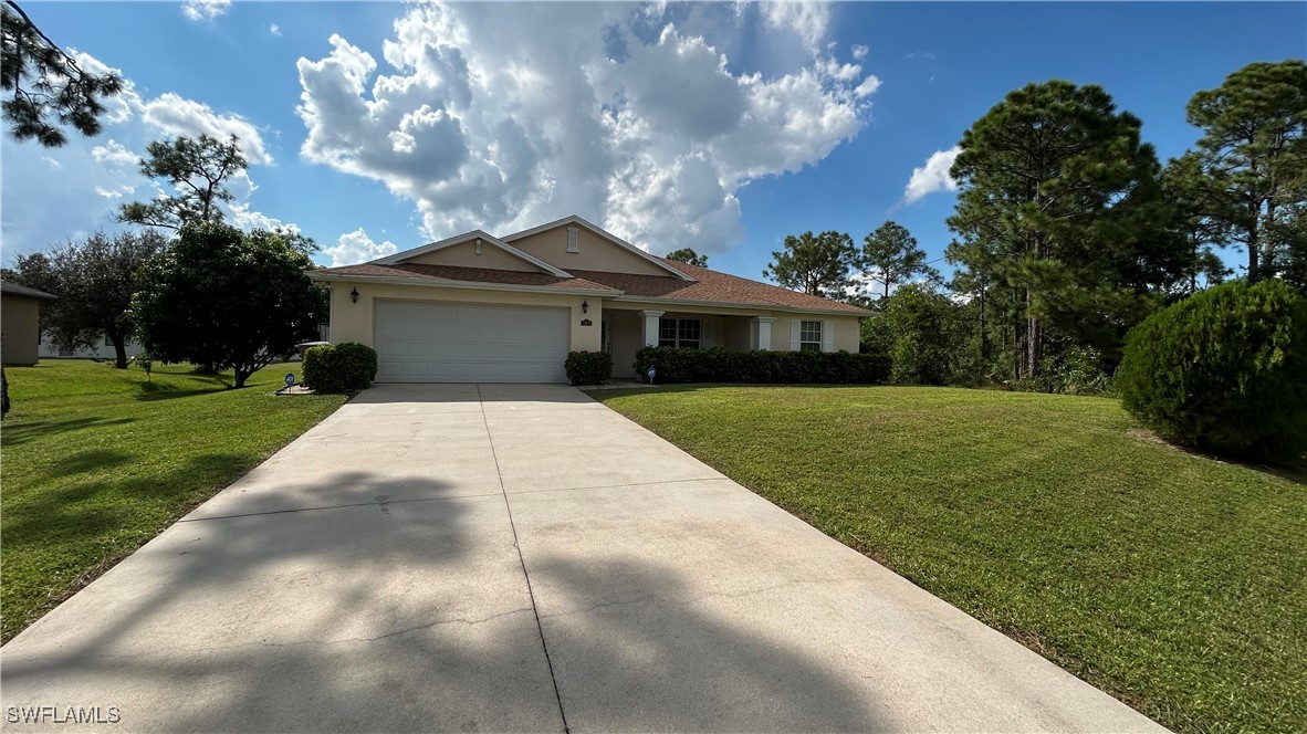 a front view of a house with yard