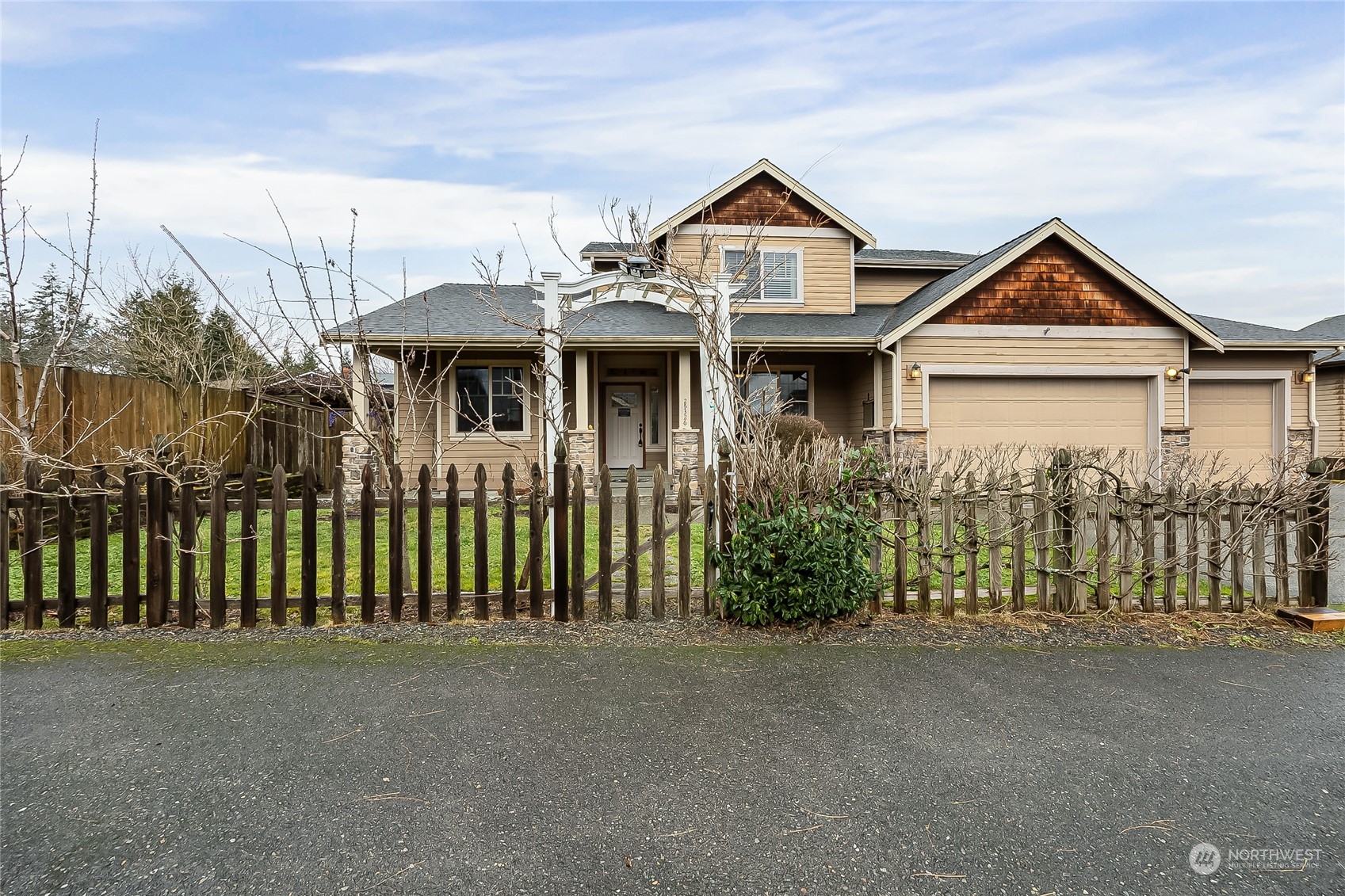 a front view of a house with a yard