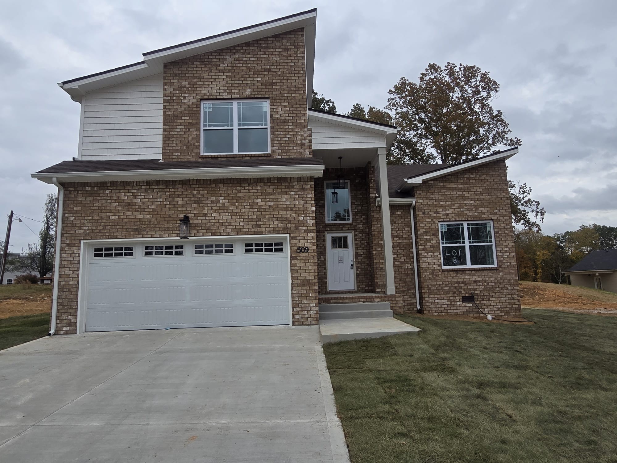 front view of a house with a yard