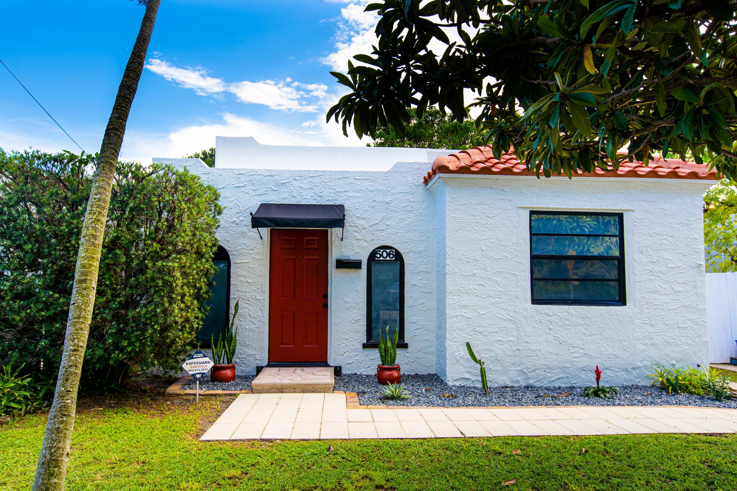 a front view of a house with garden