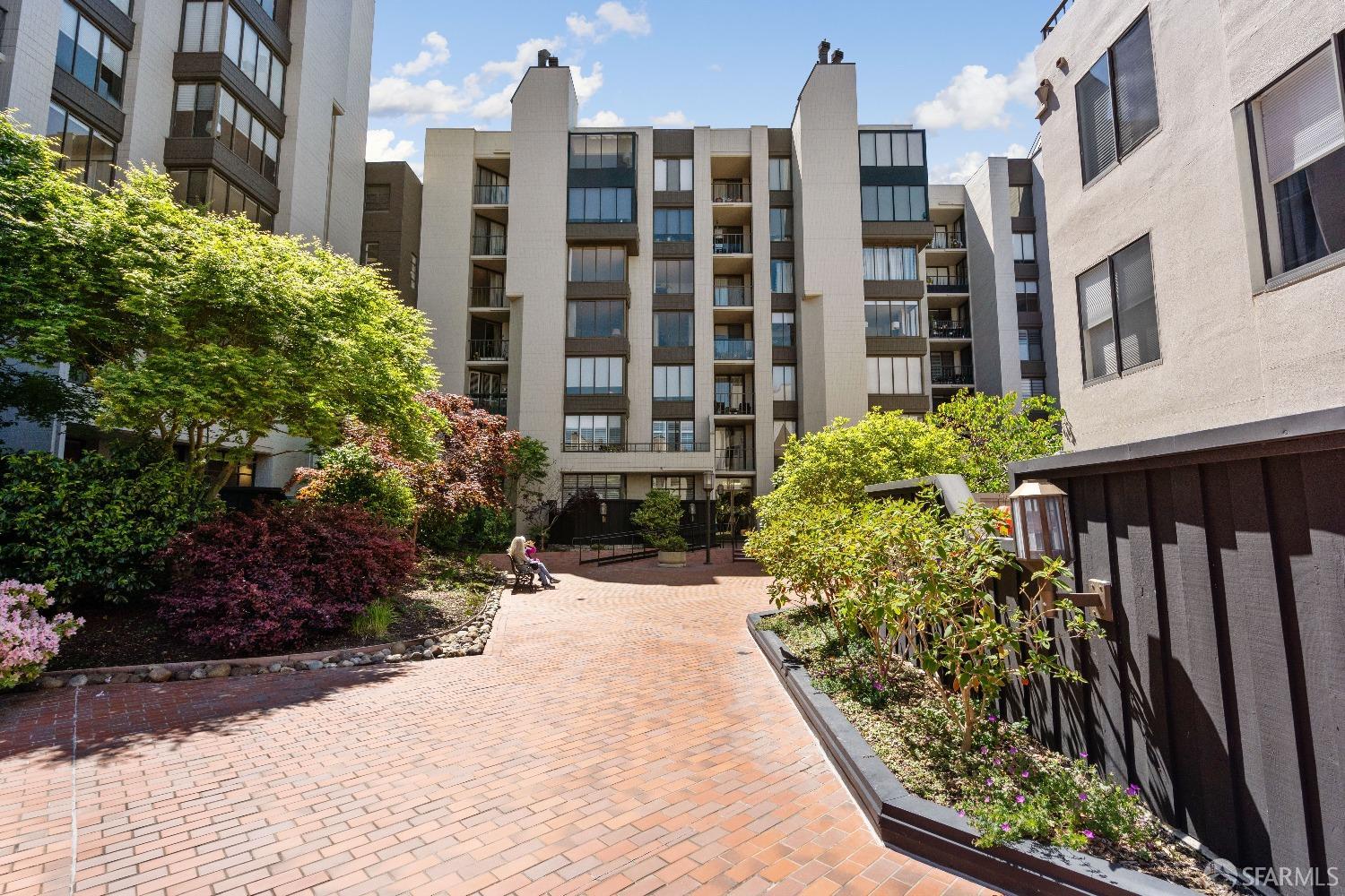 a view of a building with a garden