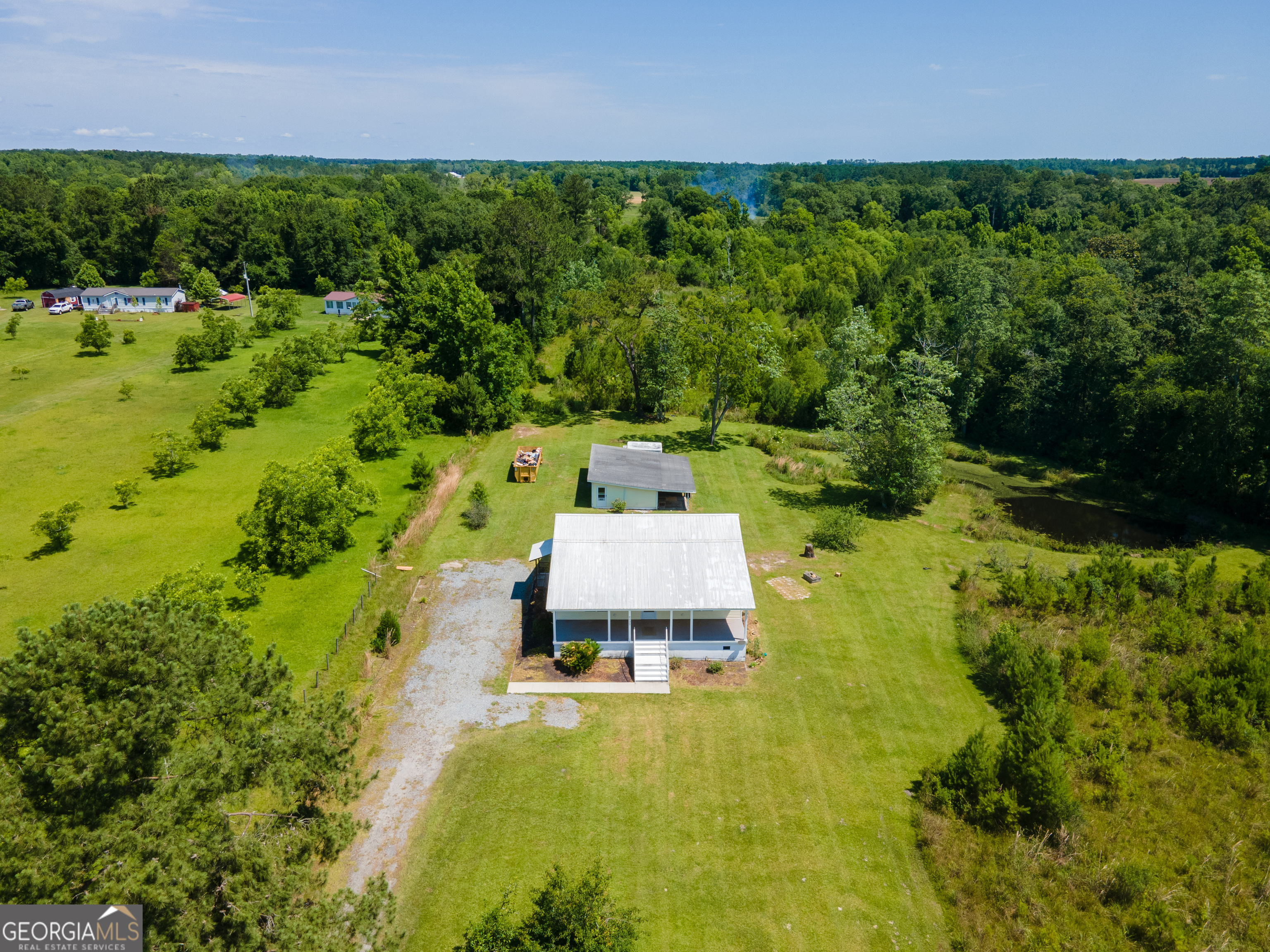 a aerial view of a house with a yard