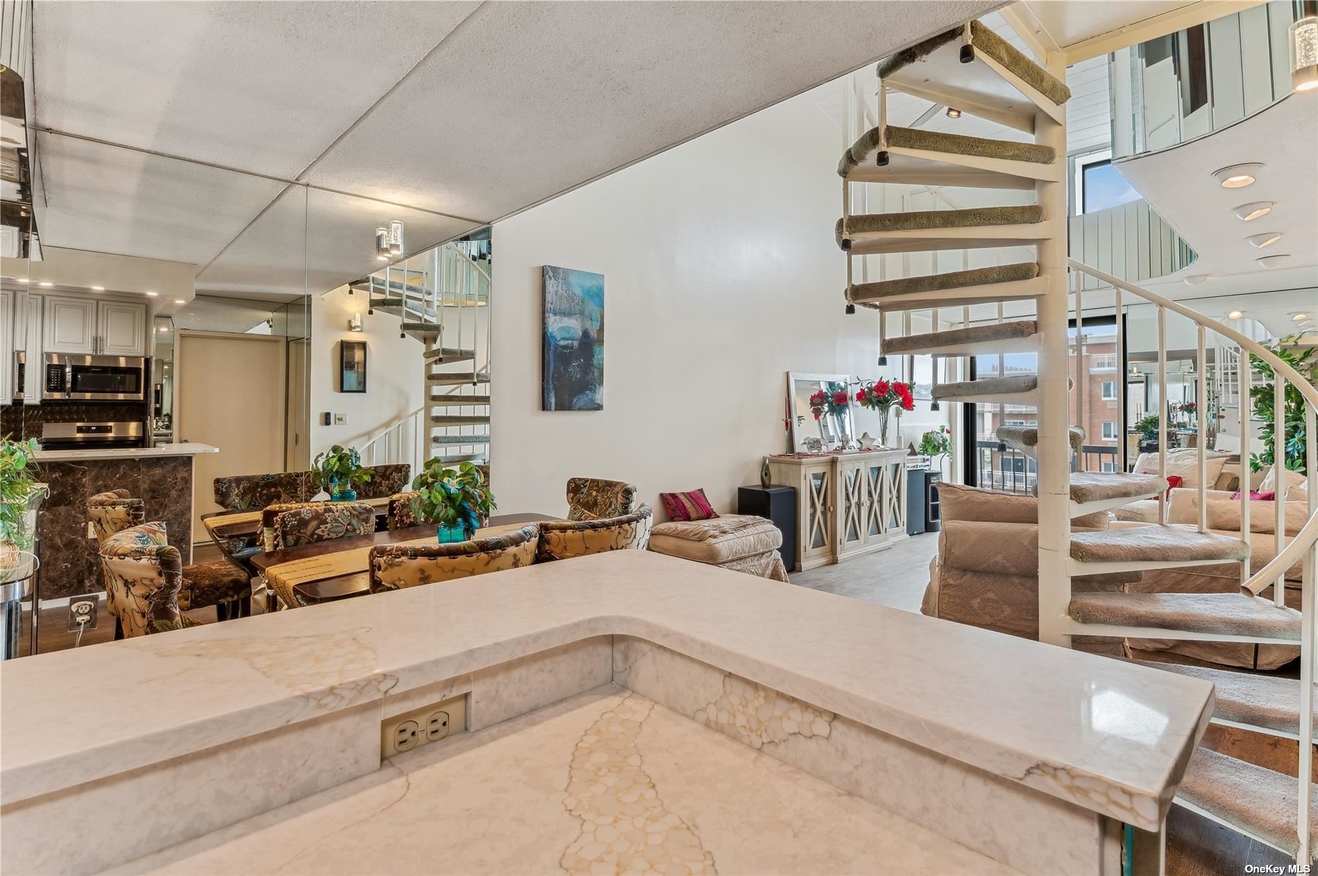 a view of a living room and entry way