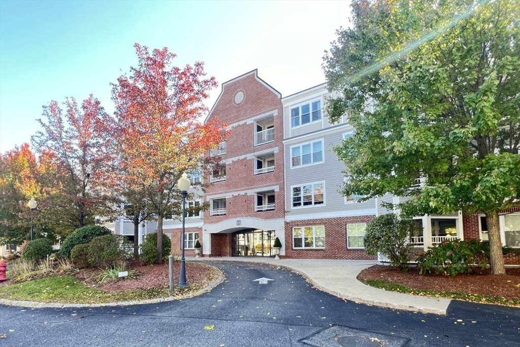 a front view of a building with garden