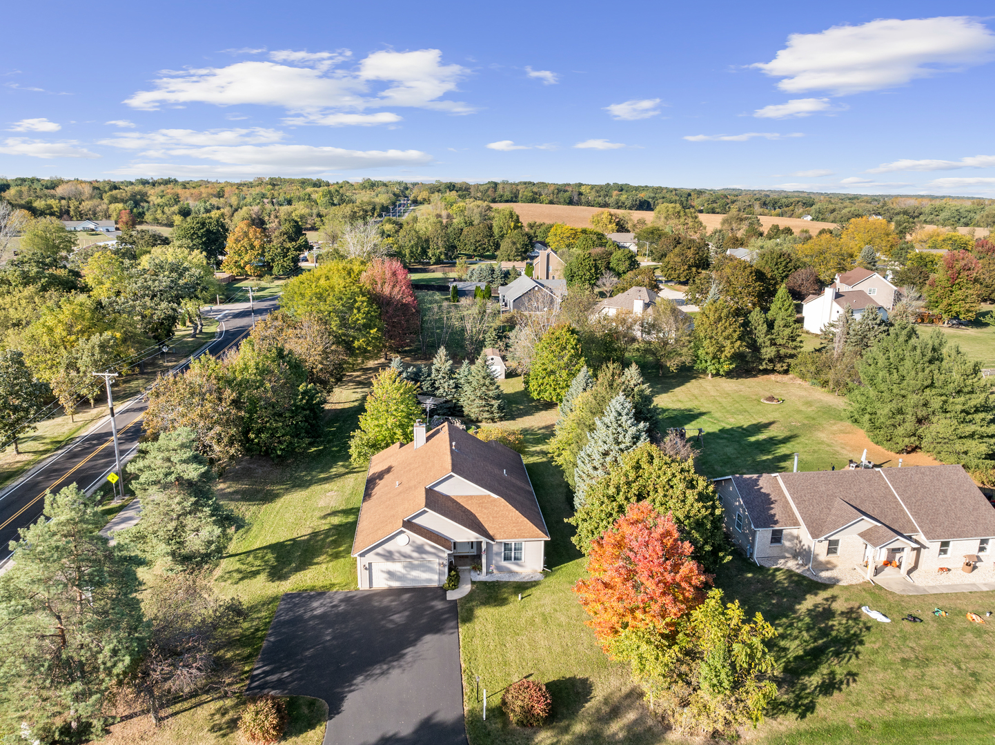 an aerial view of residential houses with outdoor space