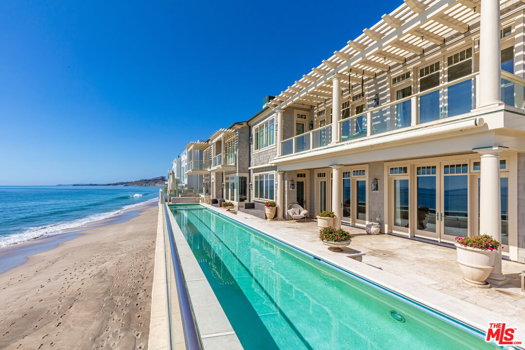 swimming pool view with a outdoor seating