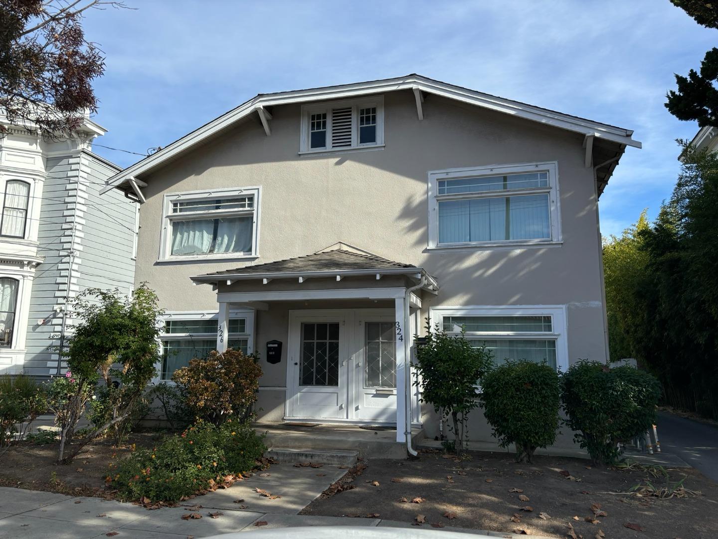 a front view of a house with garden