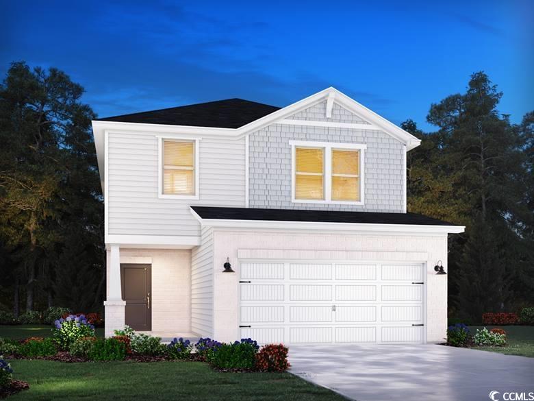 View of front of property with a garage and a fron