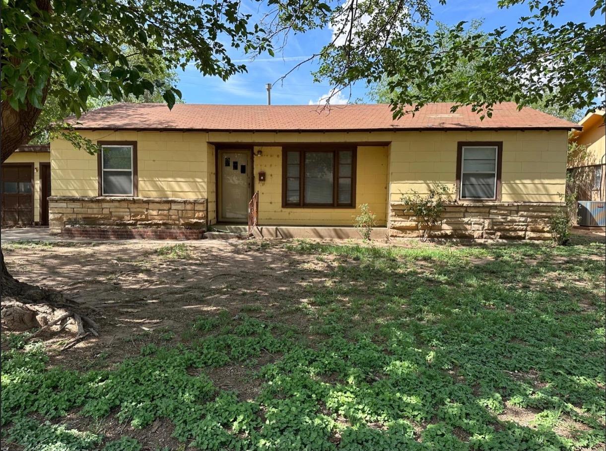 a front view of a house with yard