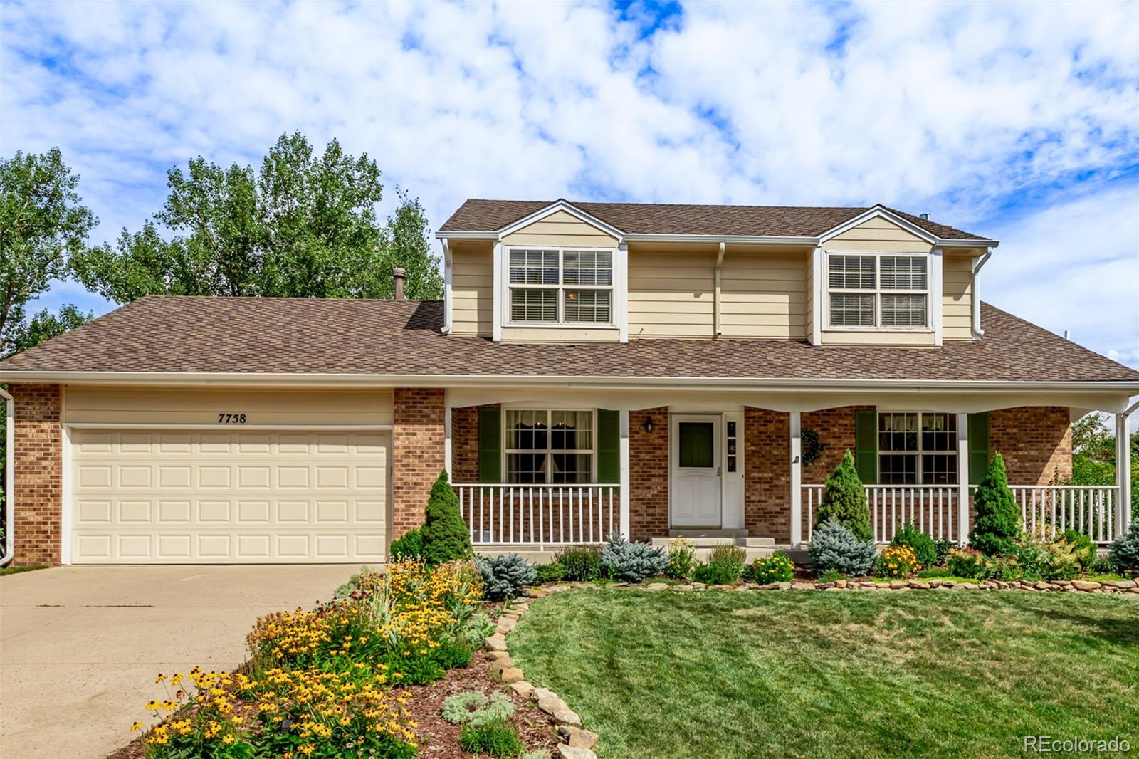 a house view with a garden space