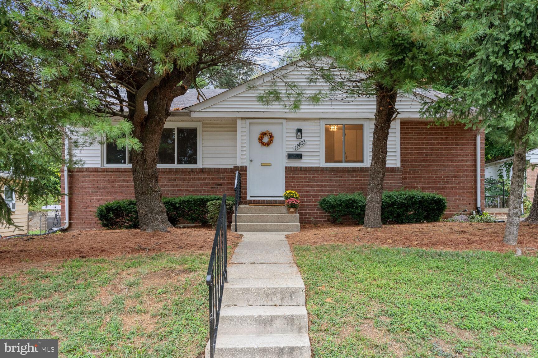 front view of a house with a yard