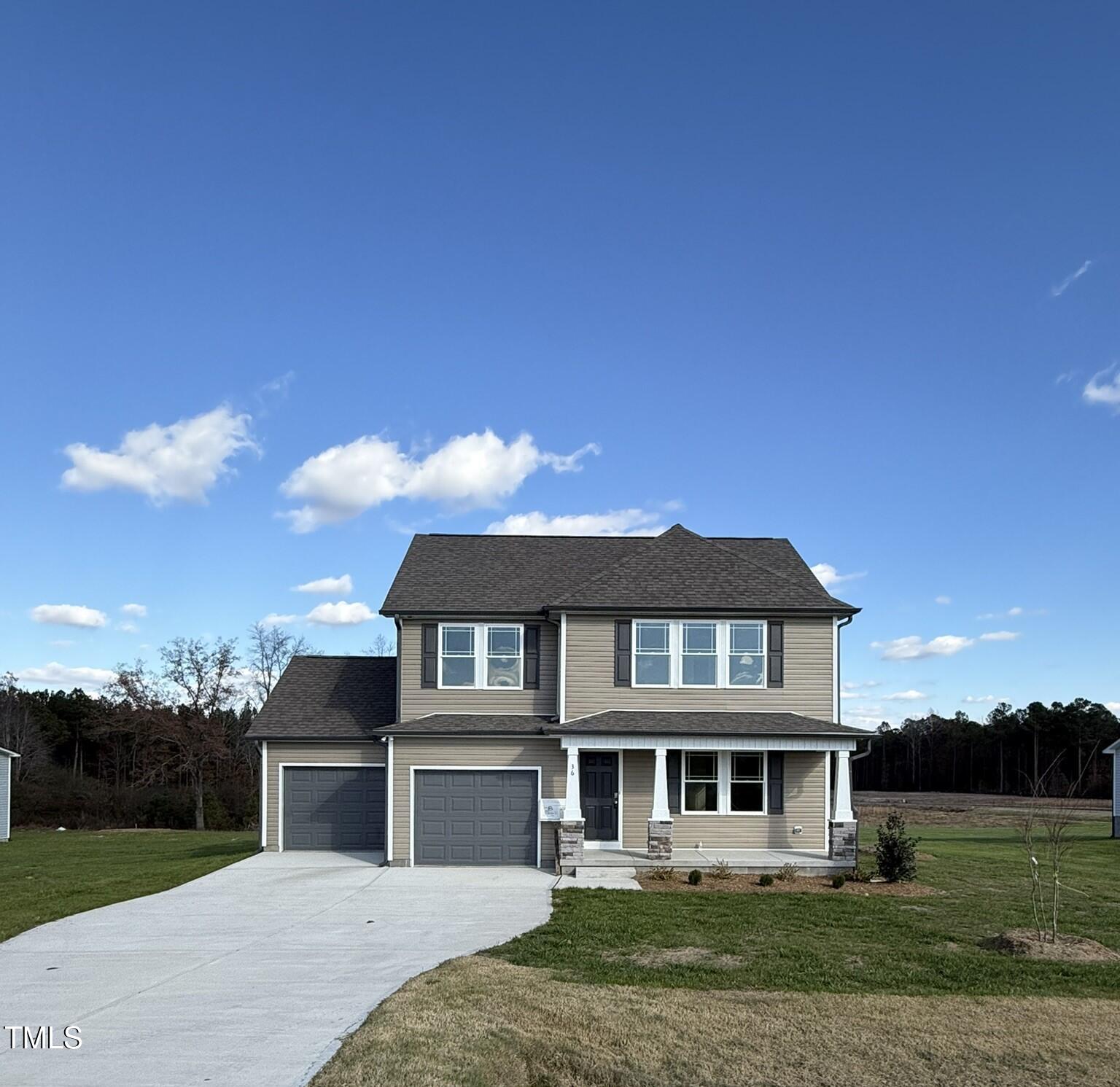 a view of a big house with a big yard