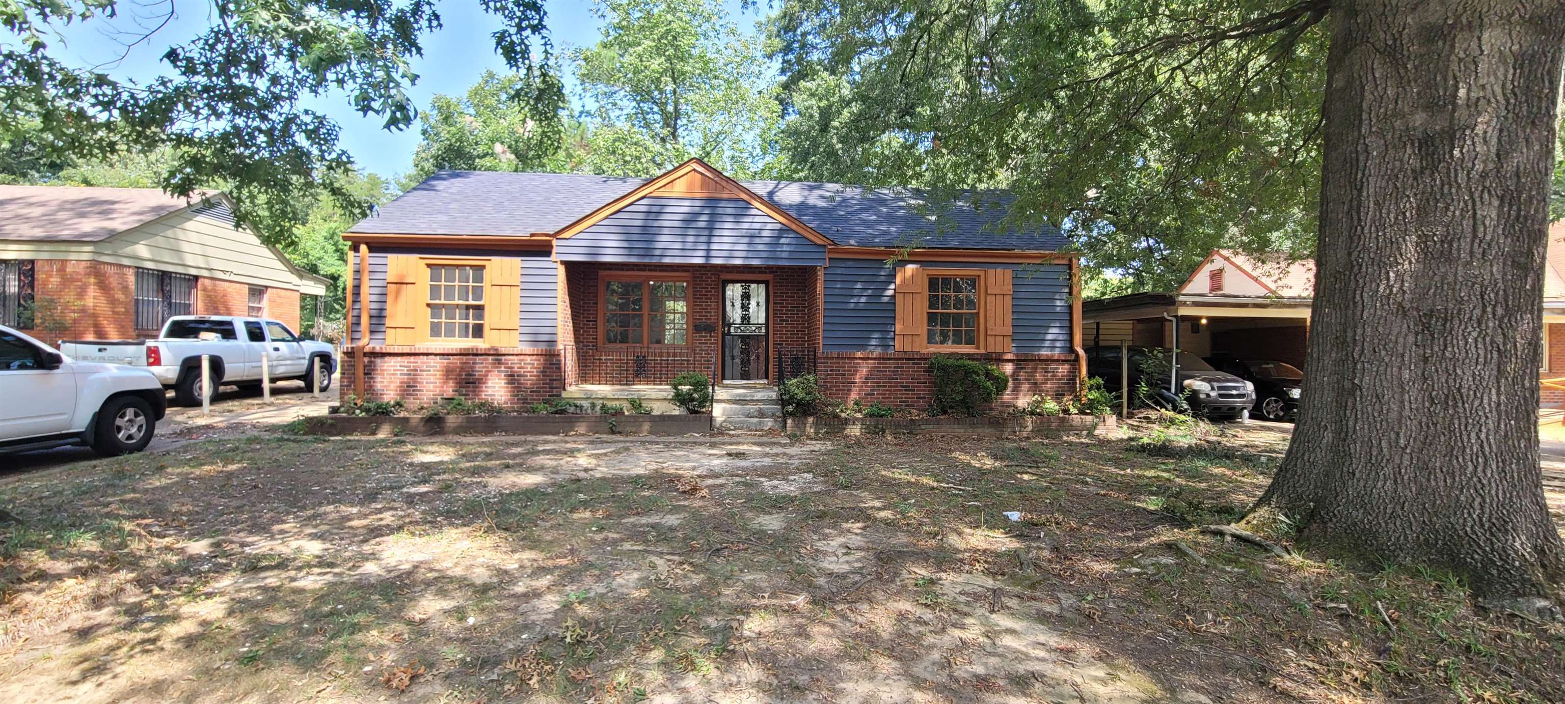 a front view of a house with a yard