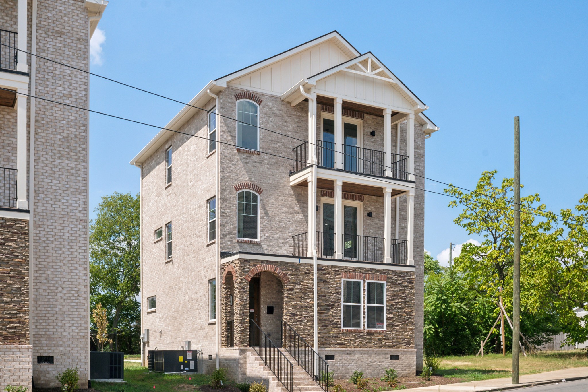 a front view of a building with a yard