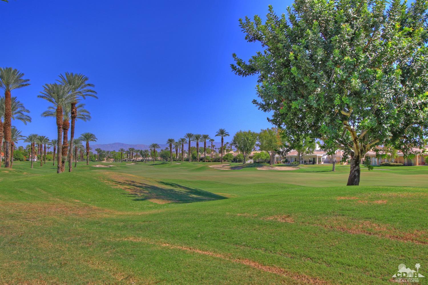 a view of a golf course with a trees