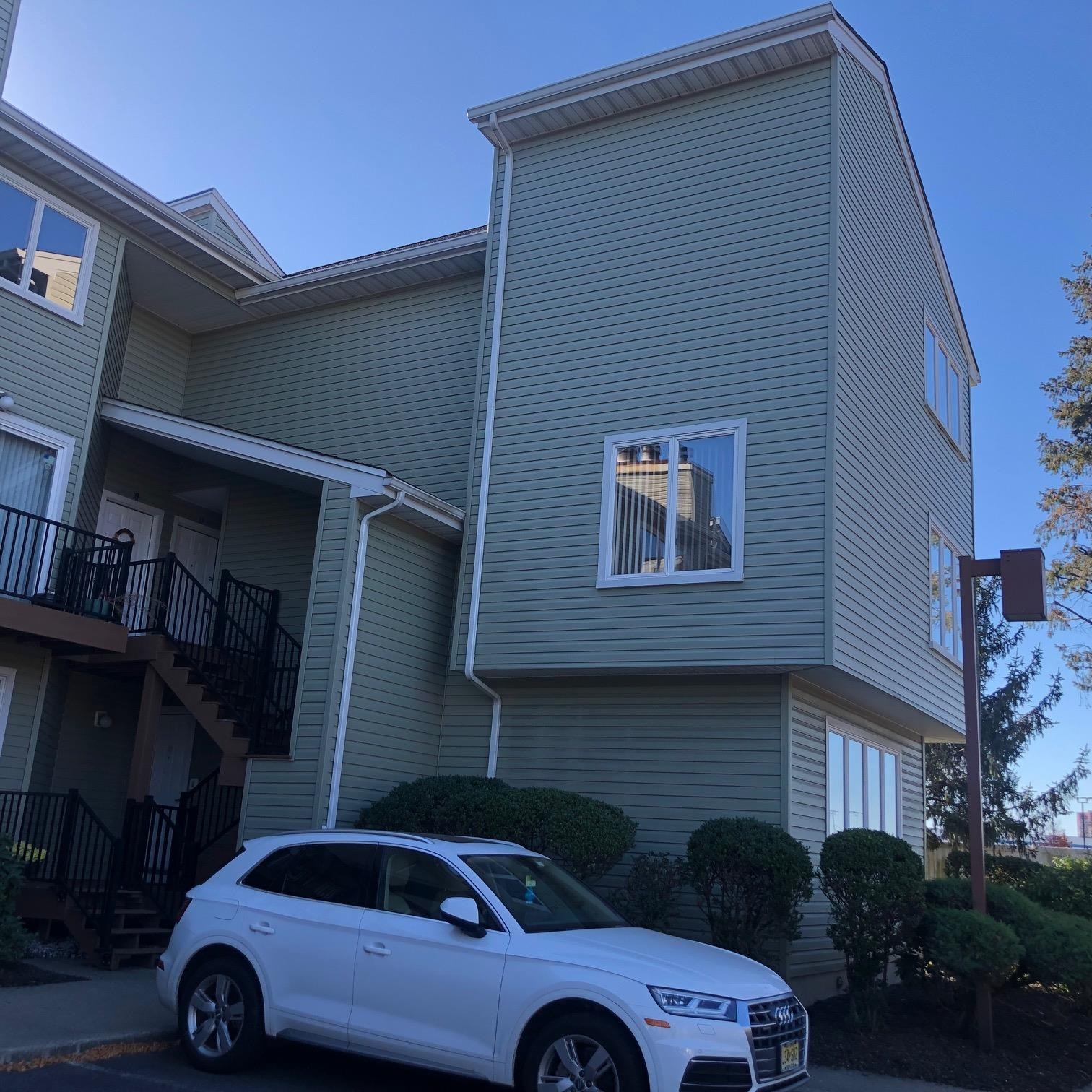 a front view of a house with parking space