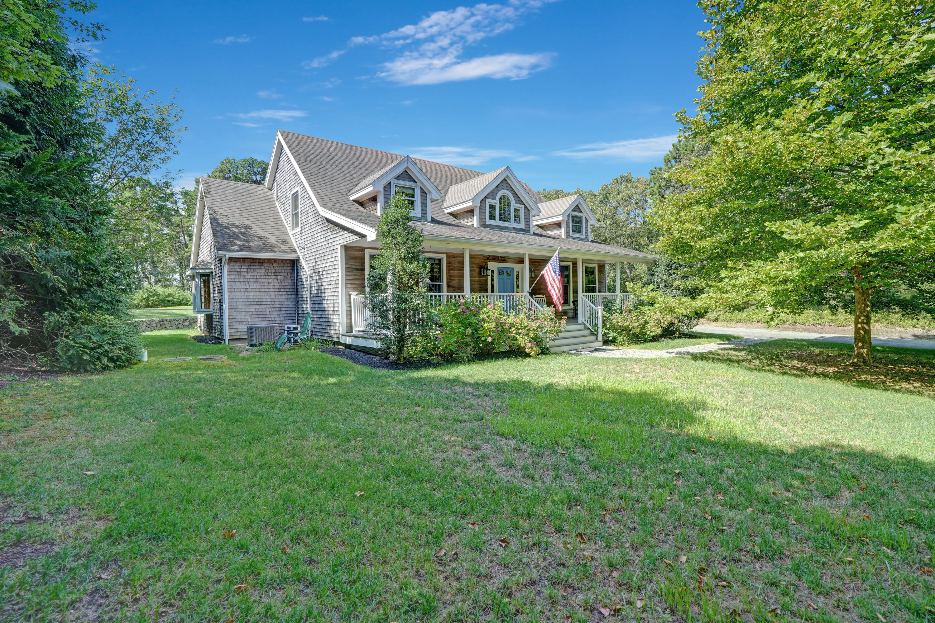 a front view of house with yard and green space