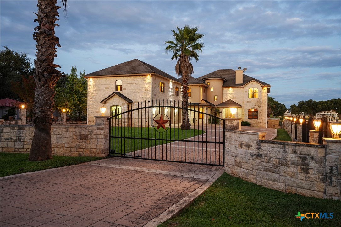 a view of a wrought iron fences in front of house