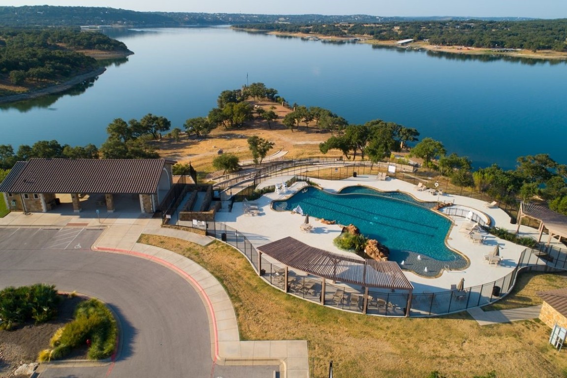 an aerial view of a house with a lake view