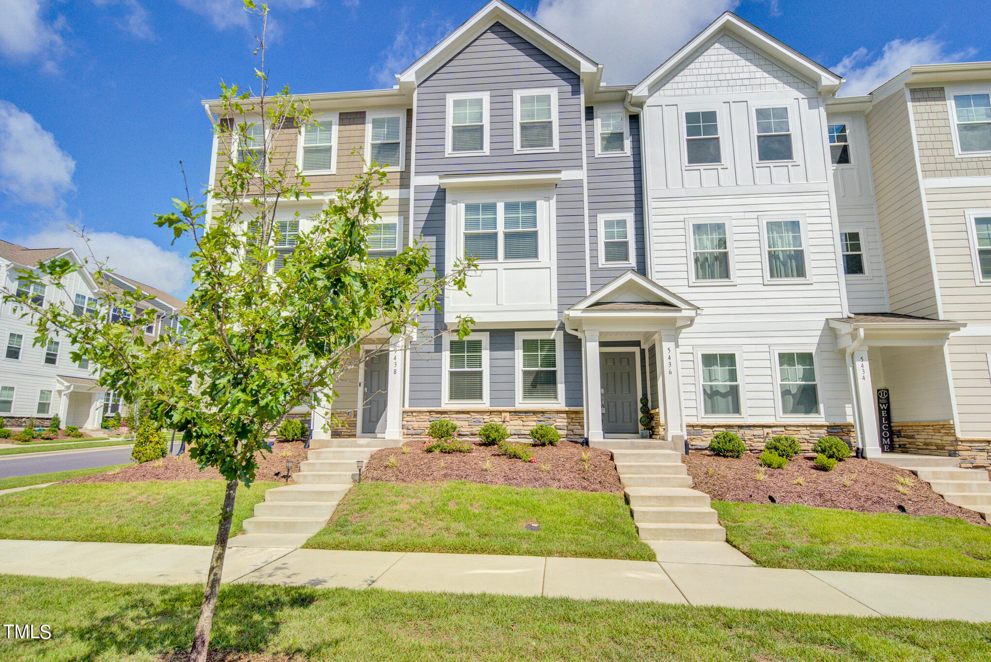 a front view of a house with yard