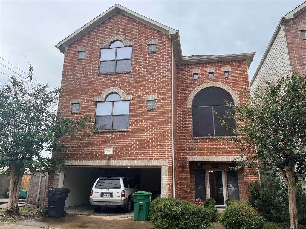 a front view of a house with parking