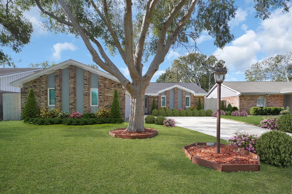 Imagine coming home every day to these beautiful flower beds and shrubs, welcoming you with warmth and making your home feel even more special. Featuring is a virtually staged front yard with vibrant flower beds, shrubs, and a majestic tree.