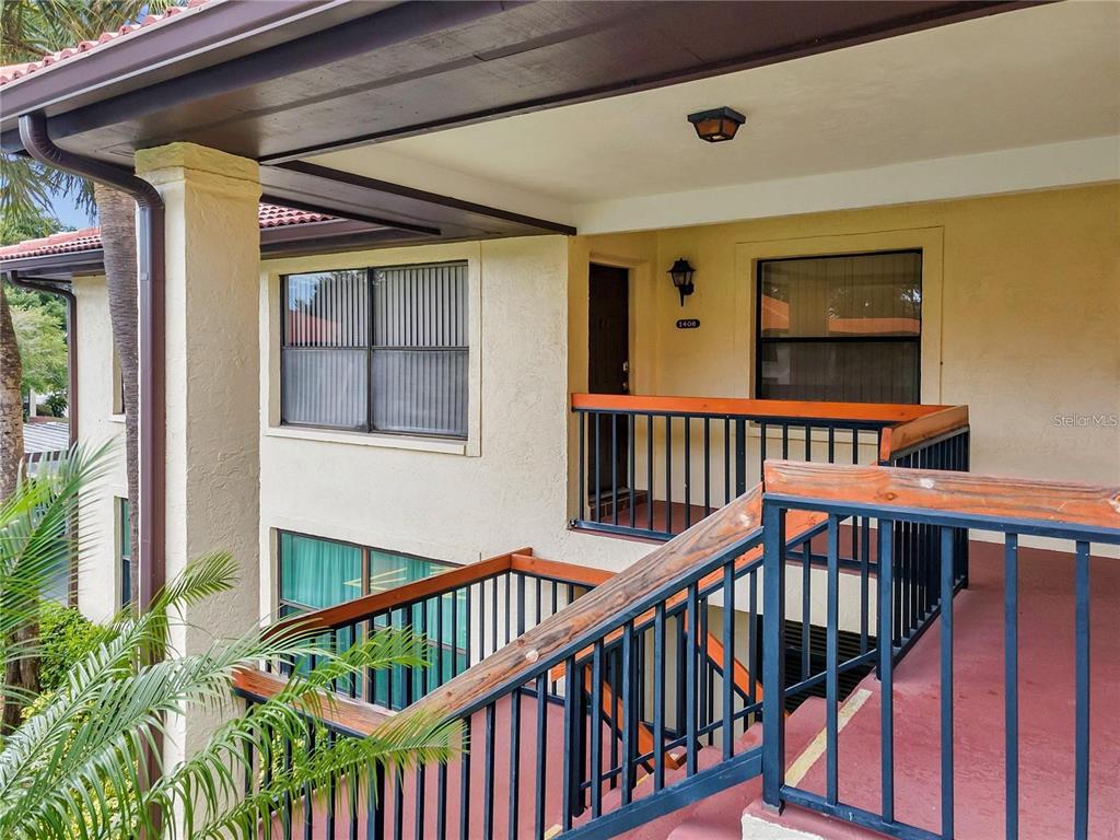 a view of balcony with furniture