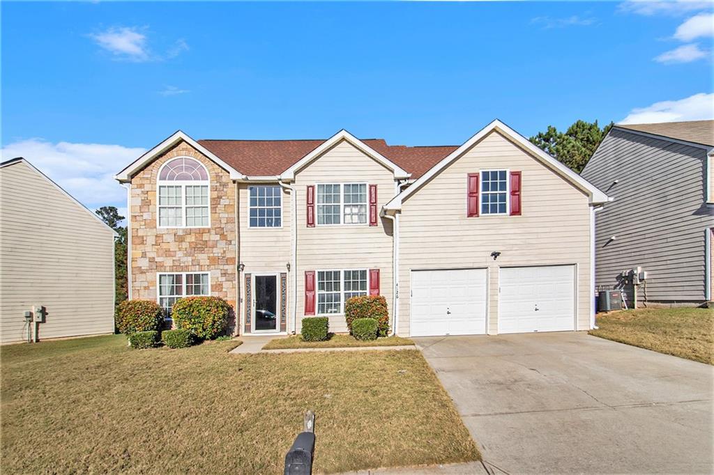 a front view of a house with a garage