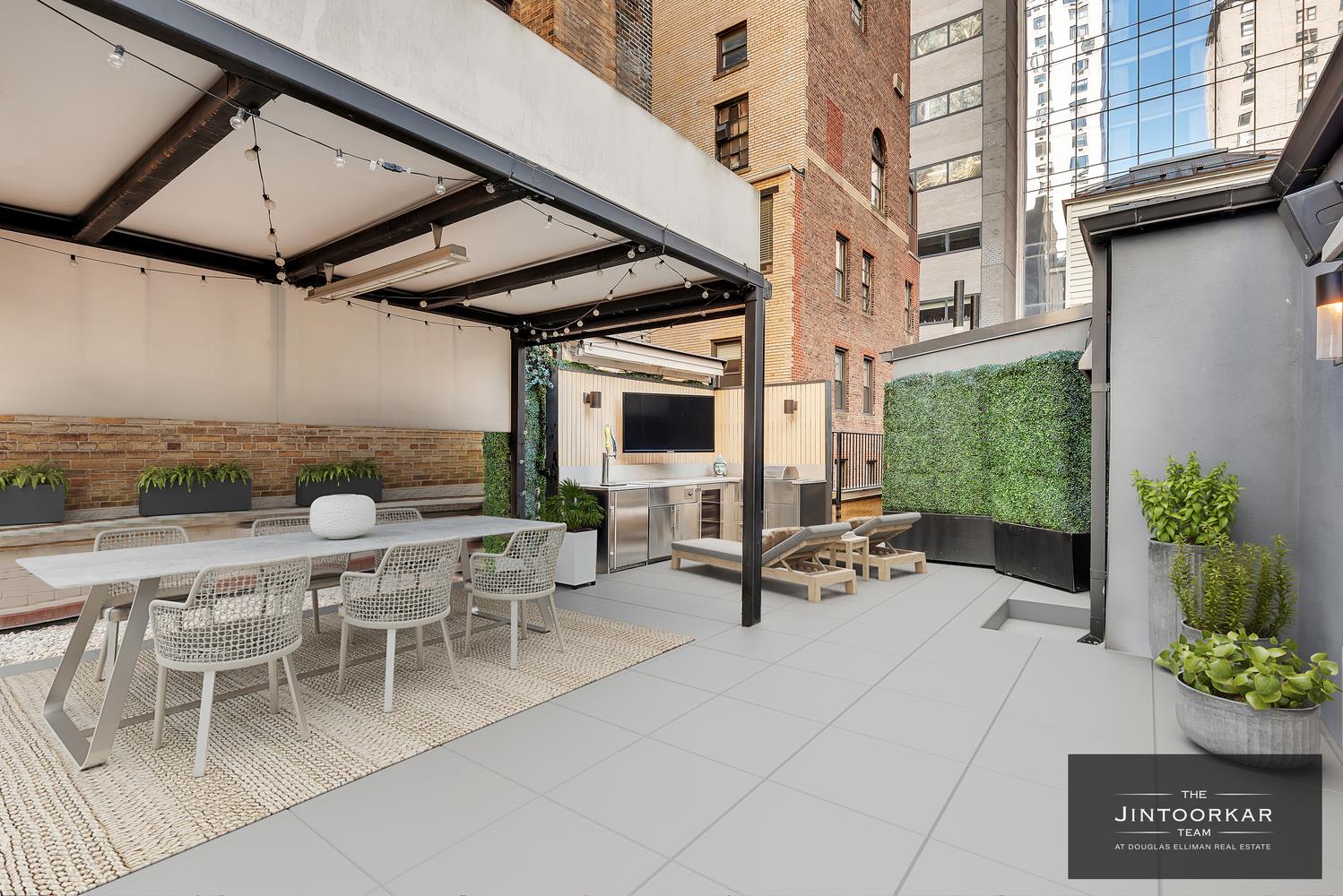 a view of a patio with a table and chairs and potted plants