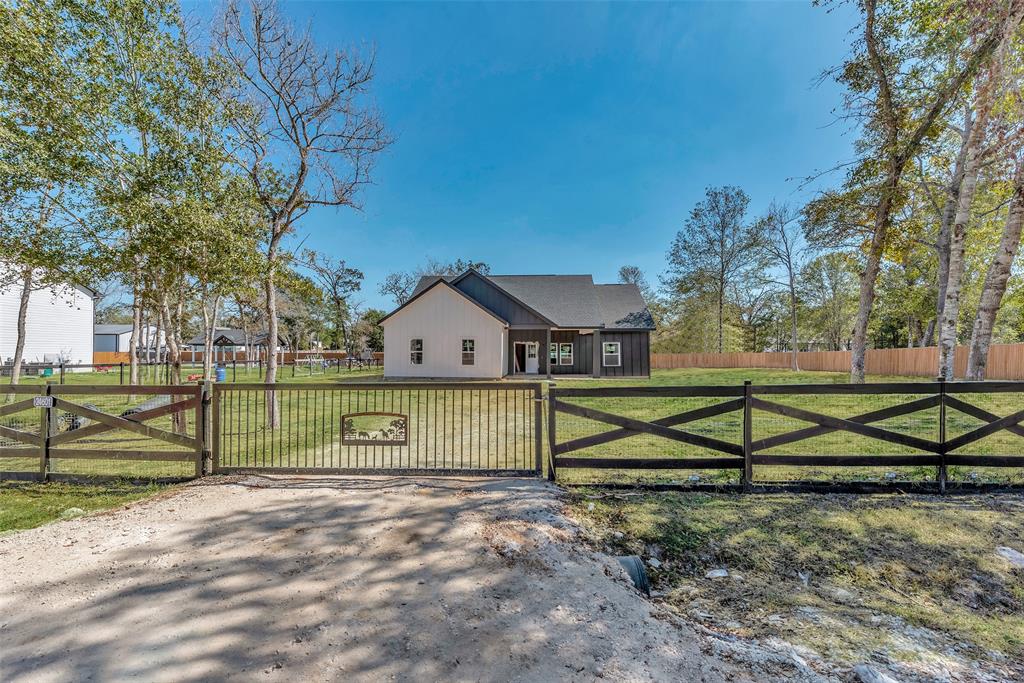 a view of playground with a house