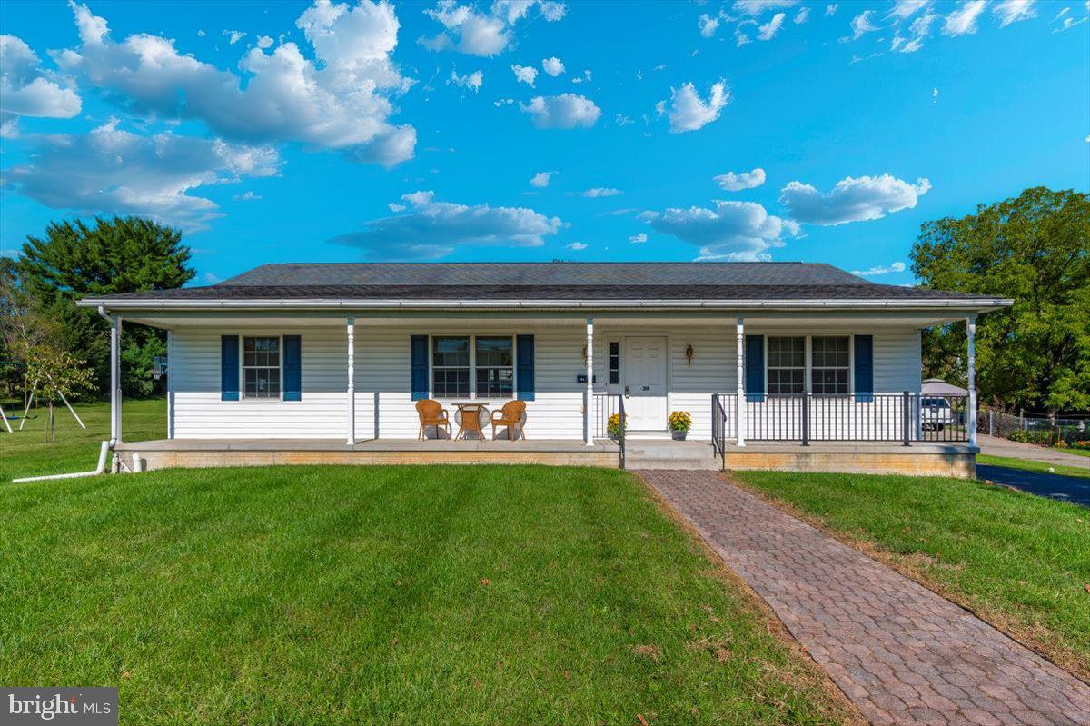 front view of a house with a yard