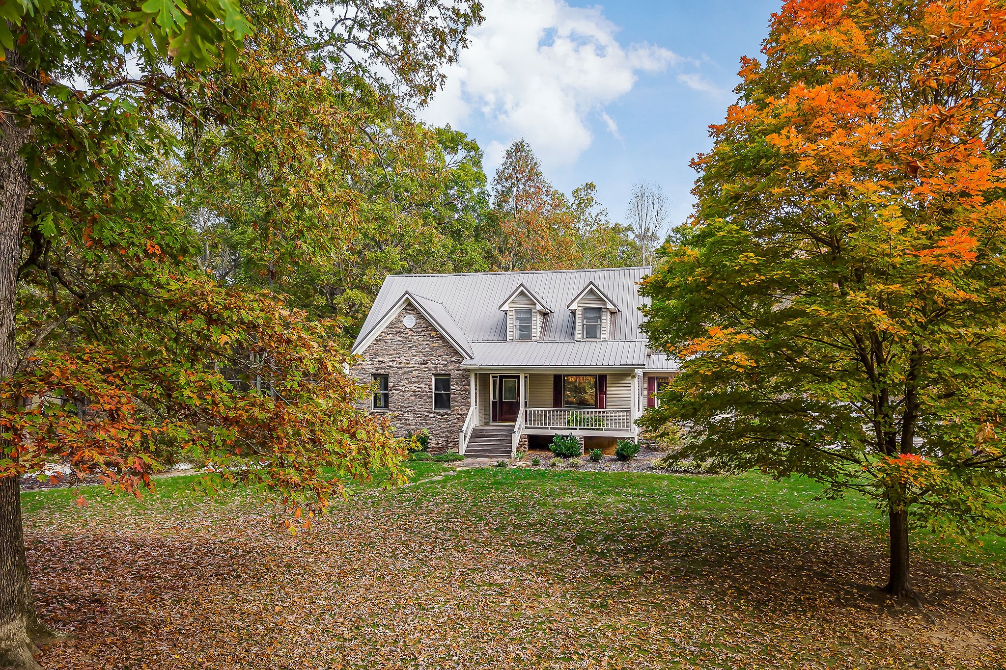 a front view of a house with a yard