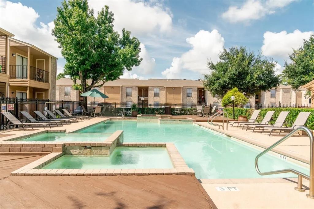 a view of a house with swimming pool and sitting area