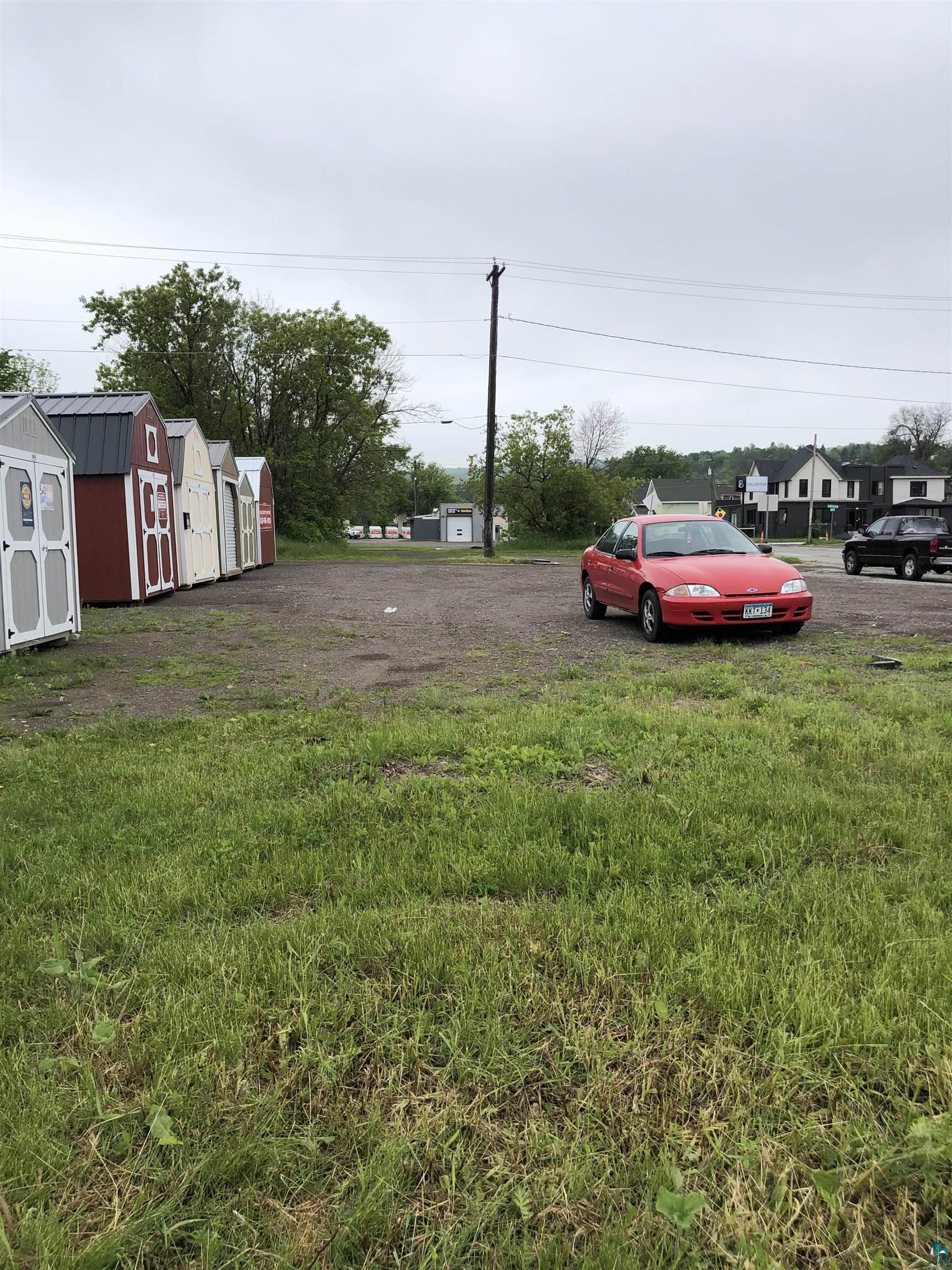 View of yard featuring a storage unit