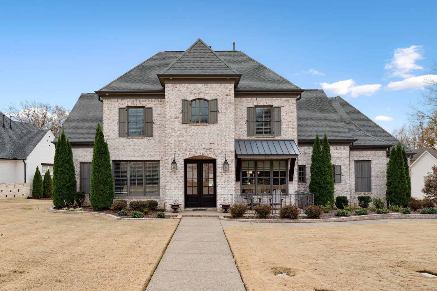 French country style house featuring french doors and covered porch