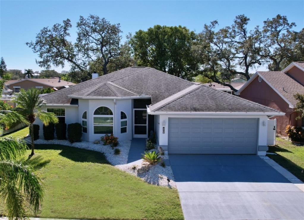 a front view of house with yard and outdoor seating