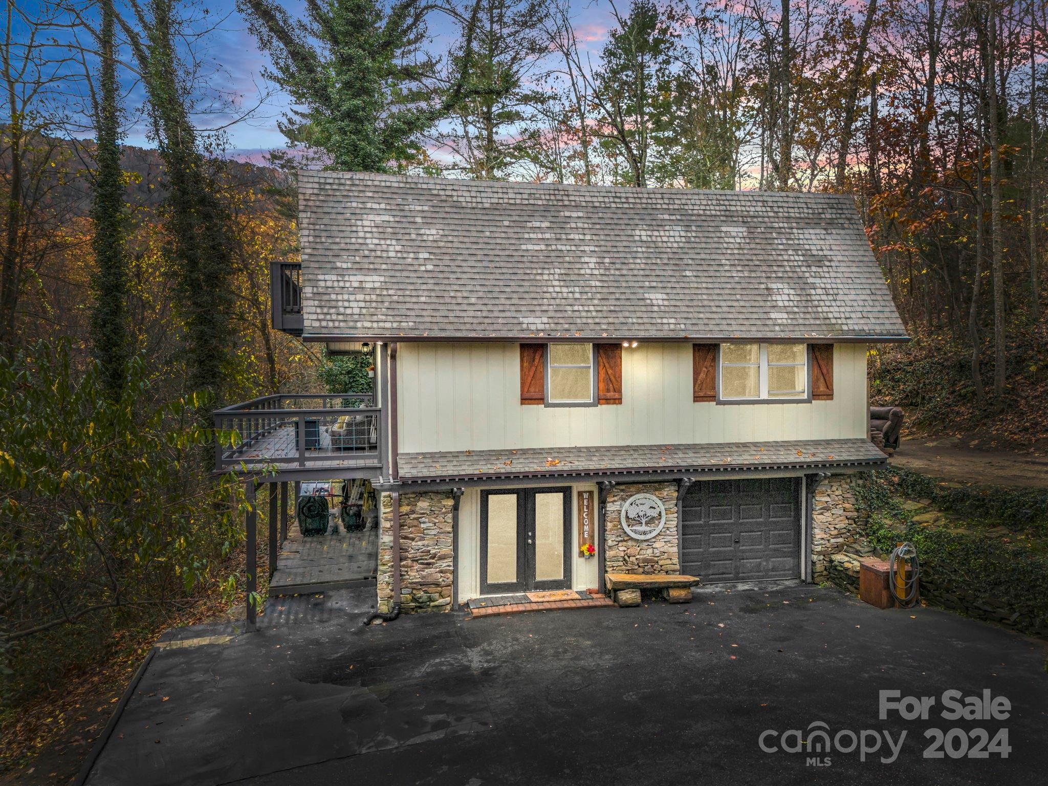 a front view of a house with garage