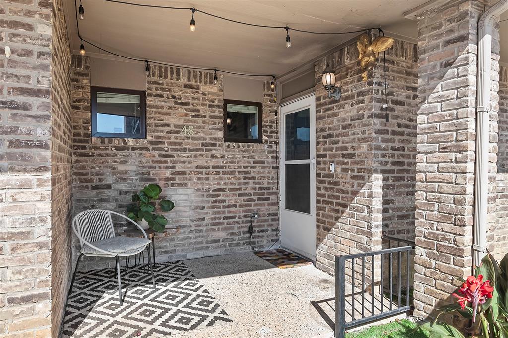 a backyard of a house with chairs