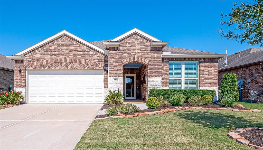 Nothing but curb appeal plus with this charming Classic Series Abbeyville Plan. This single-story brick home features a well-manicured lawn, an arched entryway with stamped concrete and a two-car garage.