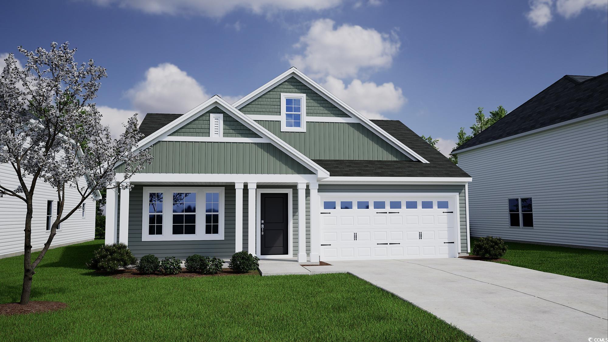 Craftsman inspired home with a garage and a front