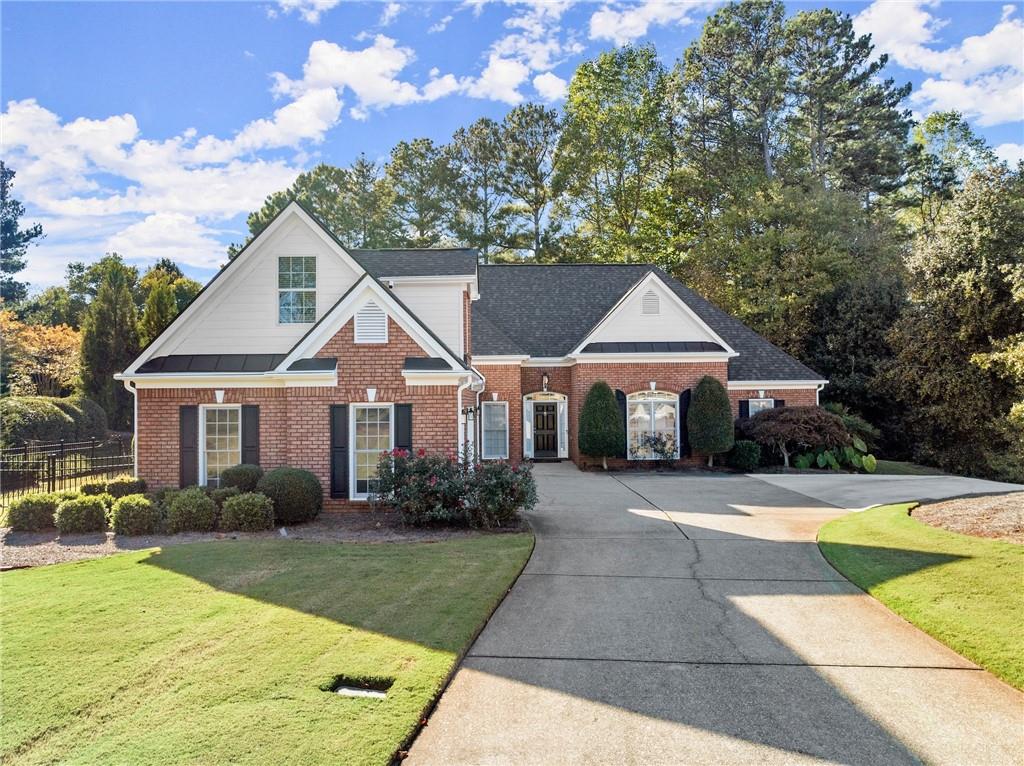 a front view of a house with garden