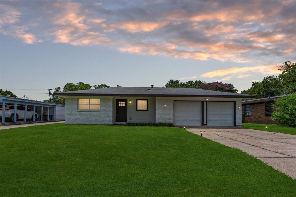 front view of a house with a yard